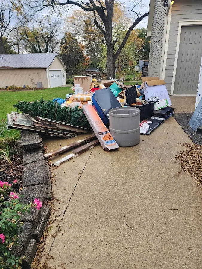 Dumpster being loaded with debris for Demolition Dumpster Rental in Union Hill-Novelty Hill